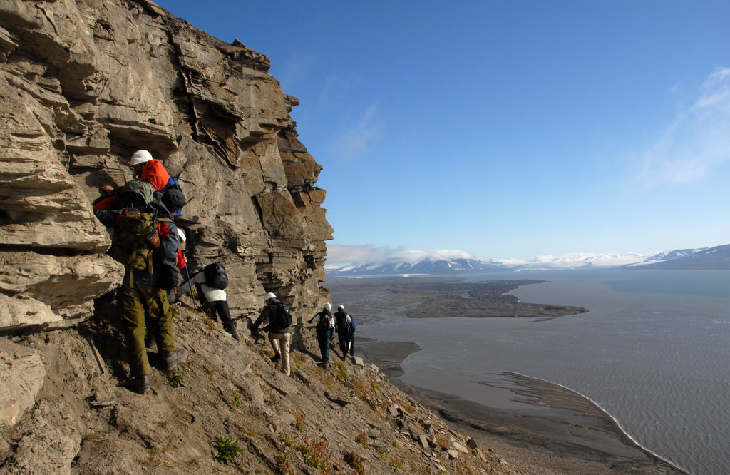 Geologists at work on the island of Spitsbergen, part of the Svalbard archipelago. The islands are located in the Arctic Ocean north of Norway. _Source: Gus MacLeod (2007) CC BY-NC-ND 2.0 [view source](https://flic.kr/p/8asQuW)_