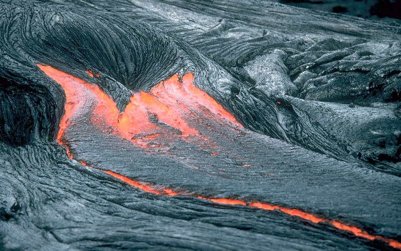 Lava flowing from Kīlauea Volcano, Hawai`i. _Source: J. D. Griggs, U. S. Geological Survey (1985) Public Domain [view source](https://volcanoes.usgs.gov/vsc/glossary/lava.html)_