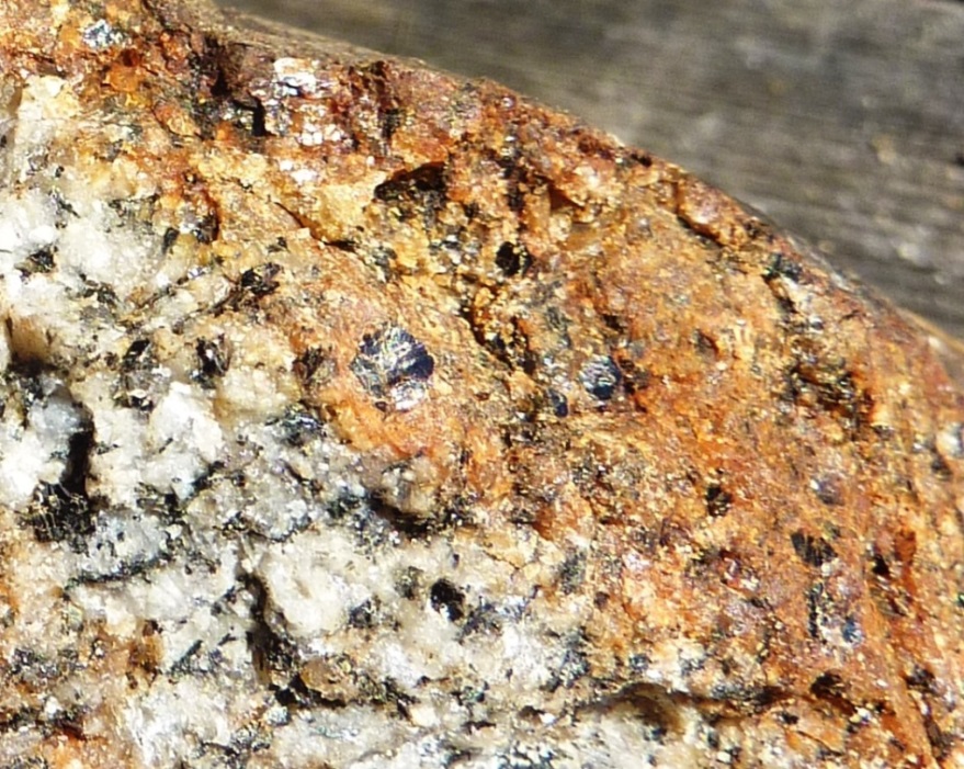 Biotite and amphibole in this granite have been altered by oxidation to limonite (orange-yellow coating), which is a mixture of iron oxide and iron hydroxyoxide minerals. _Source: Steven Earle (2015) CC-BY 4.0 [view source](https://opentextbc.ca/geology/wp-content/uploads/sites/110/2015/07/image023.jpg)_