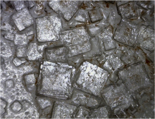 Salt crystals up to ~ 3 mm across. _Source: Steven Earle (2015) CC BY 4.0 [view source](https://opentextbc.ca/geology/wp-content/uploads/sites/110/2015/06/Evaporite.png)_