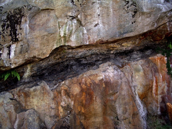 Nanaimo Group, Pender Formation. Two separate layers of fluvial sandstone with a thin (approx. 75 cm) coal seam in between. _Source: Steven Earle (2015) CC BY 4.0 [view source](http://opentextbc.ca/geology/wp-content/uploads/sites/110/2015/06/fluvial-sandstone.png)_