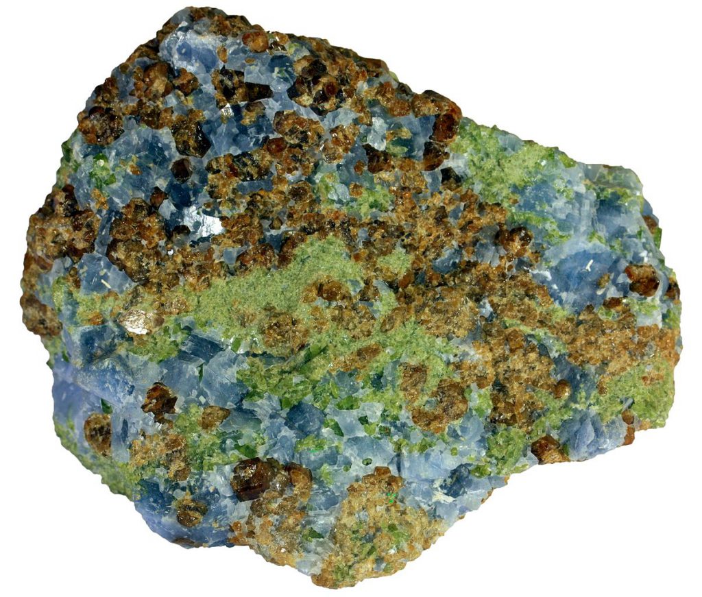 Skarn from Mount Monzoni, Northern Italy, with recrystallized calcite (blue), garnet (brown), and pyroxene (green). The rock is 6 cm across. _Source: Siim Sepp (2012) CC BY-SA 3.0 [view source](https://commons.wikimedia.org/wiki/File:00031_6_cm_grossular_calcite_augite_skarn.jpg)_