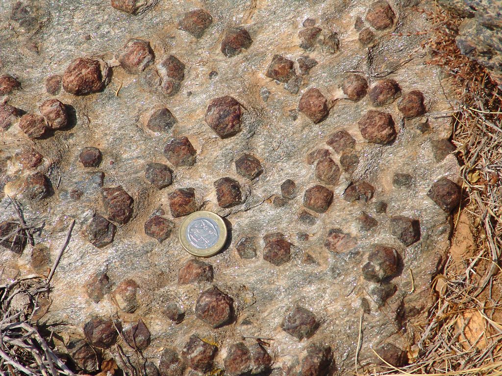 Garnet-mica schist from the Greek island of Syros. _Source: Graeme Churchard (2005) CC BY 2.0 [view source](https://flic.kr/p/5kN6n)_
