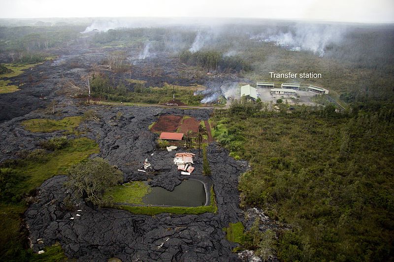 Lava flow from Kīlauea's Puʻu ʻŌʻō crater. Lava (in black) has destroyed a house and threatens a transfer station. _Source: U. S. Geological Survey (2014) Public Domain [view source](https://commons.wikimedia.org/wiki/File:USGS_K%C4%ABlauea_MultimediaFile-978.jpg)_