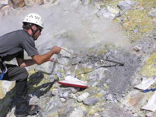 A geologist collects a gas sample from Sherman Crater, Mt. Baker, Washington. Gas is drawn through a titanium tube inserted in a fumarole, and collected in a glass vacuum flask. _Source: D. Tucker, U. S. Geological Survey (2006) Public Domain [view source](http://www.mbvrc.wwu.edu/images/GasSampling.jpg)_
