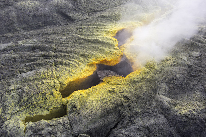 A fumarole at Puʻu ʻŌʻō Crater, Hawaii. The yellow crust along the margin of the fumarole is made of sulphur crystals. The crystals form when sulphur vapour cools as it is released from the fumarole. _Source: U. S. Geological Survey (2016) Public Domain [View source](https://www.flickr.com/photos/usgeologicalsurvey/23998018863/in/album-72157637377510893/)<br>_