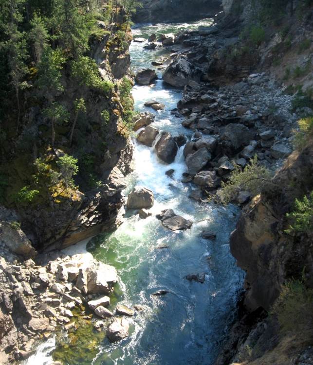 The Cascade Falls area of the Kettle River, near Christina Lake, BC. This stream has a step-pool morphology and a deep bedrock channel. Source: Steven Earle (2015) CC BY 4.0 [view source](https://opentextbc.ca/geology/wp-content/uploads/sites/110/2015/08/Cascade-Falls-area.jpg)