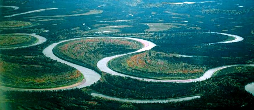 The meandering channel of the Nowitna River, Alaska. Numerous oxbow lakes are present, and another meander cutoff will soon take place. Source: Oliver Kumis (2002) CC-BY-SA 2.0 [view source](http://bit.ly/1SmQL7B)