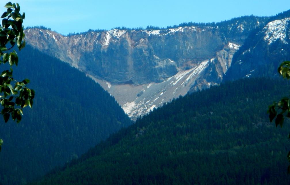 | The Barrier, south of Whistler, BC, was the site of a huge rock avalanche in 1855, which extended from the cliff visible here 4 km down the valley and across the current location of the Sea-to-Sky Highway and the Cheakamus River. _ Source: Steven Earle (2015) CC BY 4.0. [View source](https://opentextbc.ca/geology/) _