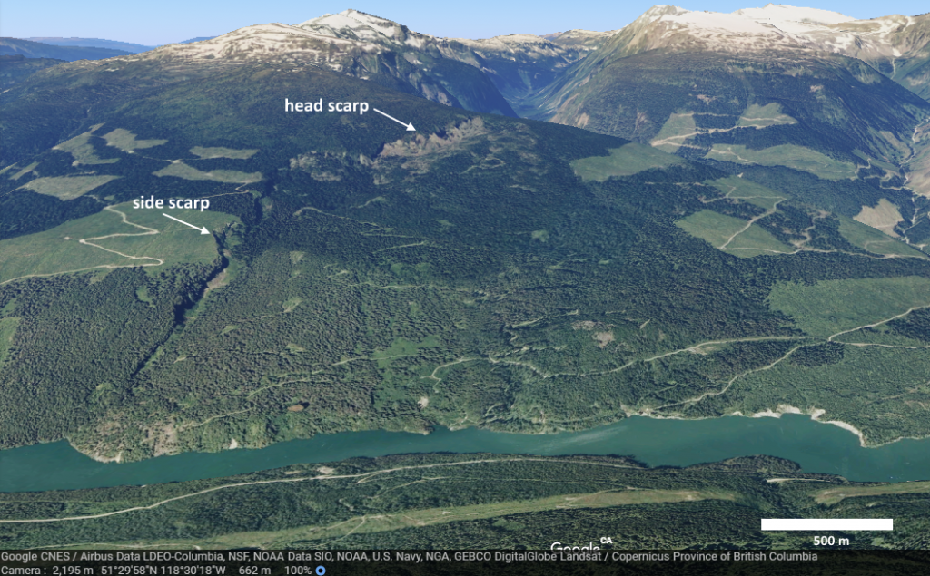 | The Downie Slide, a sackung, on the shore of the Revelstoke Reservoir (above the Revelstoke Dam). The head scarp is visible at the top and a side-scarp along the left side. Source: Joyce McBeth (2018) CC BY 4.0, image © 2018 Google Earth, Data Google CNES / Airbus Data LDEO-Columbia, NSF, NOAA Data SIO, NOAA, U.S. Navy, NGA, GEBCO DigitalGlobe Landsat / Copernicus Province of BC.