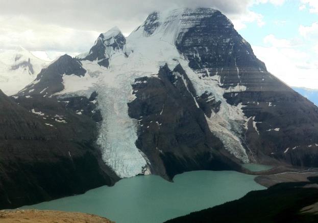 Mt. Robson, the tallest peak in the Canadian Rockies, hosts the Berg Glacier (centre), and Berg Lake. Although there were no icebergs visible when this photo was taken, the Berg Glacier loses mass by shedding icebergs into Berg Lake. _Source: Steven Earle (2015) CC BY 4.0_ [_view source_](https://opentextbc.ca/geology/wp-content/uploads/sites/110/2015/07/Mt.-Robson.jpg)