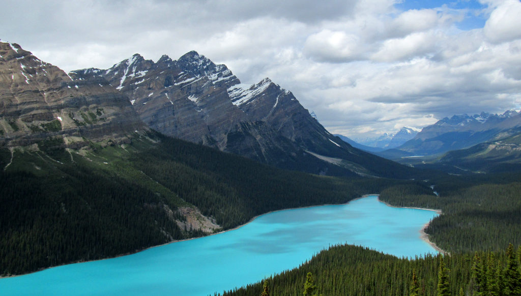Peyto Lake in the Alberta Rockies, is both a finger lake and a moraine lake, as it is flooding a glacial valley, and is dammed by an end moraine at right. _Source: Jeff Hollet (2016) Public Domain [view source](https://flic.kr/p/HJVqwo)_