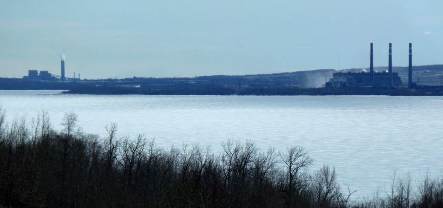 The Highvale Mine (background) and the Sundance (right) and Keephills (left) generating stations on the southern shore of Wabamun Lake, Alberta [SE]