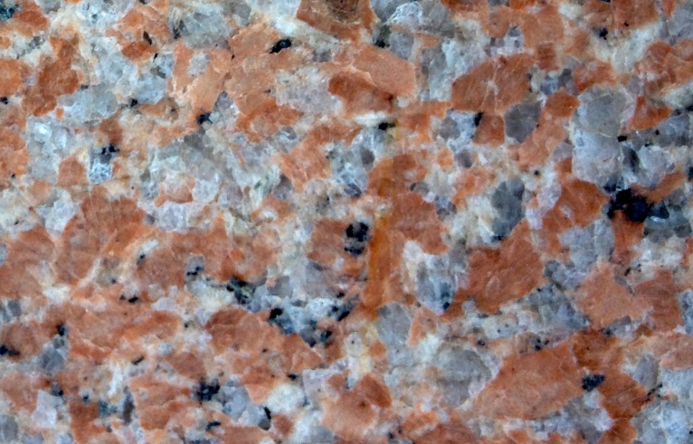 Crystals of potassium feldspar (pink) in a granitic rock are candidates for isotopic dating using the K-Ar method because they contained potassium and no argon when they formed. _Source: Steven Earle (2015) CC BY 4.0 [view source](https://opentextbc.ca/geology/wp-content/uploads/sites/110/2015/07/Crystals-of-potassium-feldspar.jpg)_